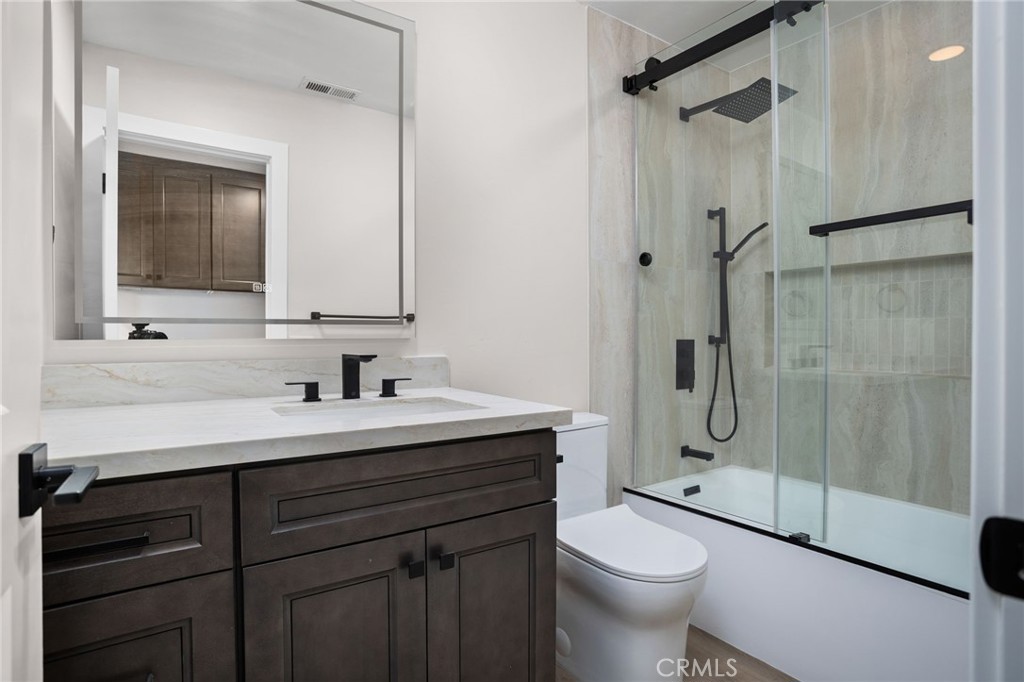29566 Big Range Road, Unit 1 Canyon Lake, CA 92587 - Photo 29 of 55 a bathroom with a sink a toilet and shower