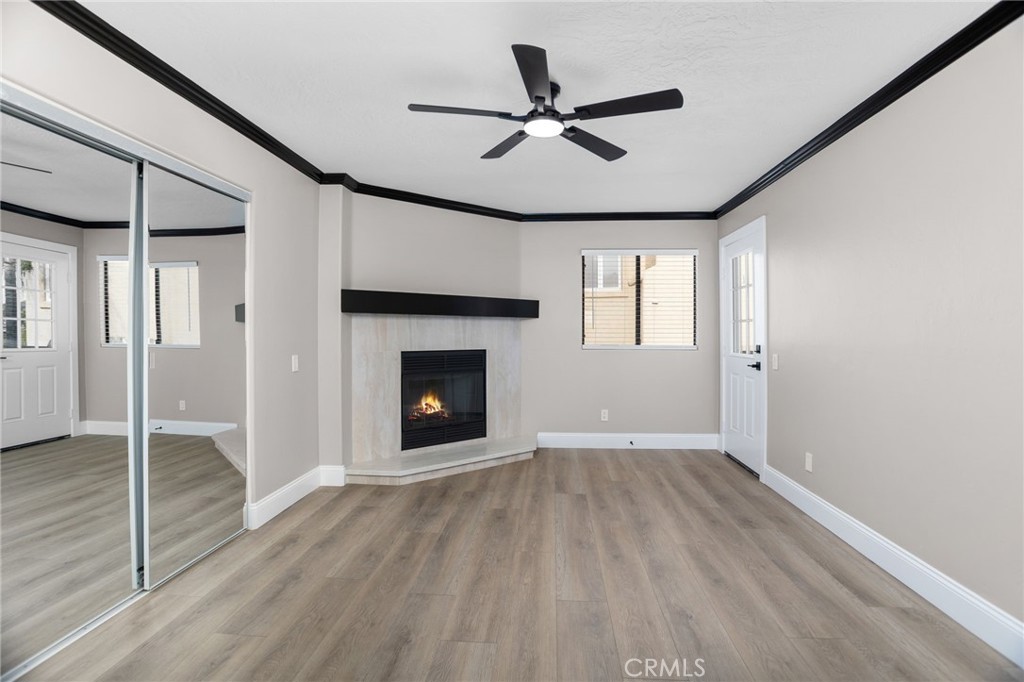 29566 Big Range Road, Unit 1 Canyon Lake, CA 92587 - Photo 31 of 55 wooden floor in an empty room with a fireplace