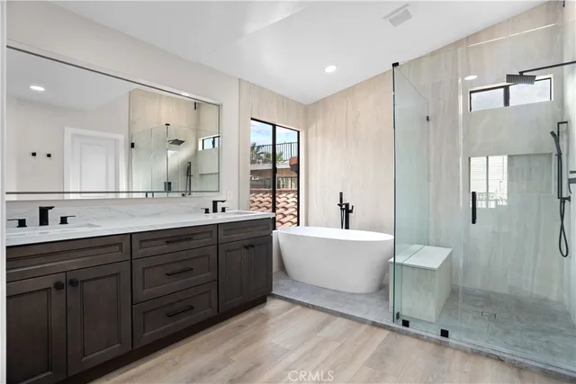 a bathroom with a double vanity sink and a mirror