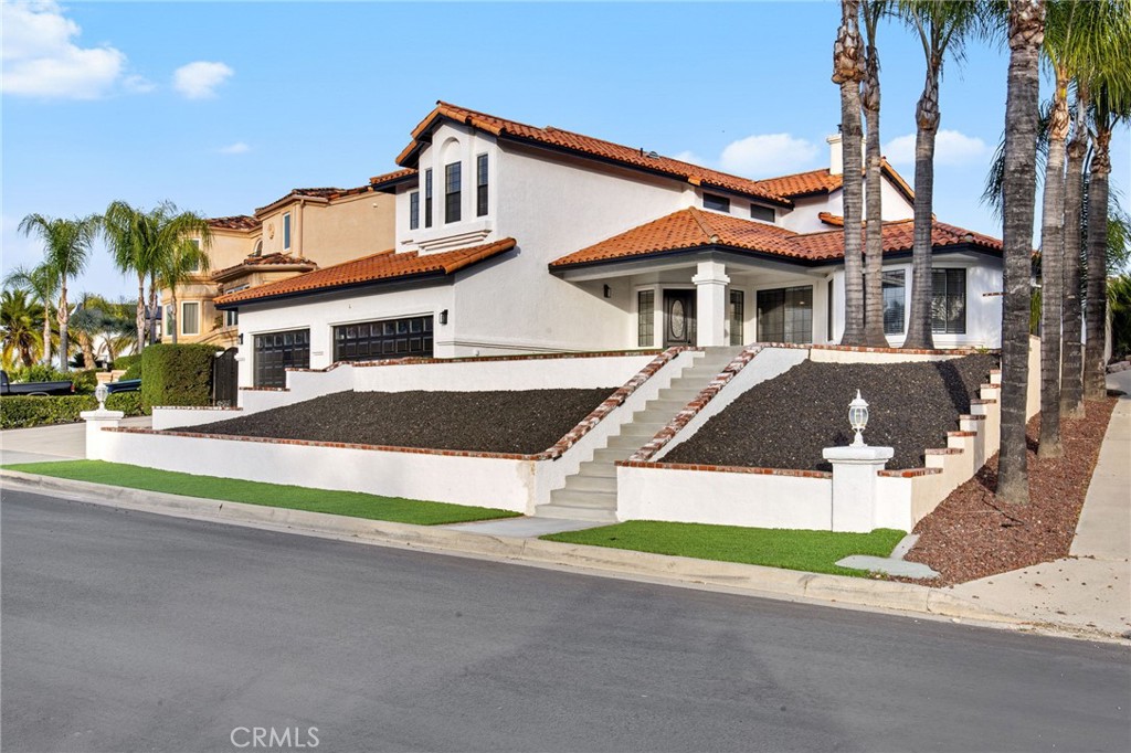 29566 Big Range Road, Unit 1 Canyon Lake, CA 92587 - Photo 5 of 55 a front view of a house with a yard and garage