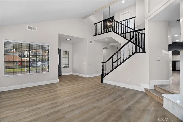 a view of an entryway with wooden floor