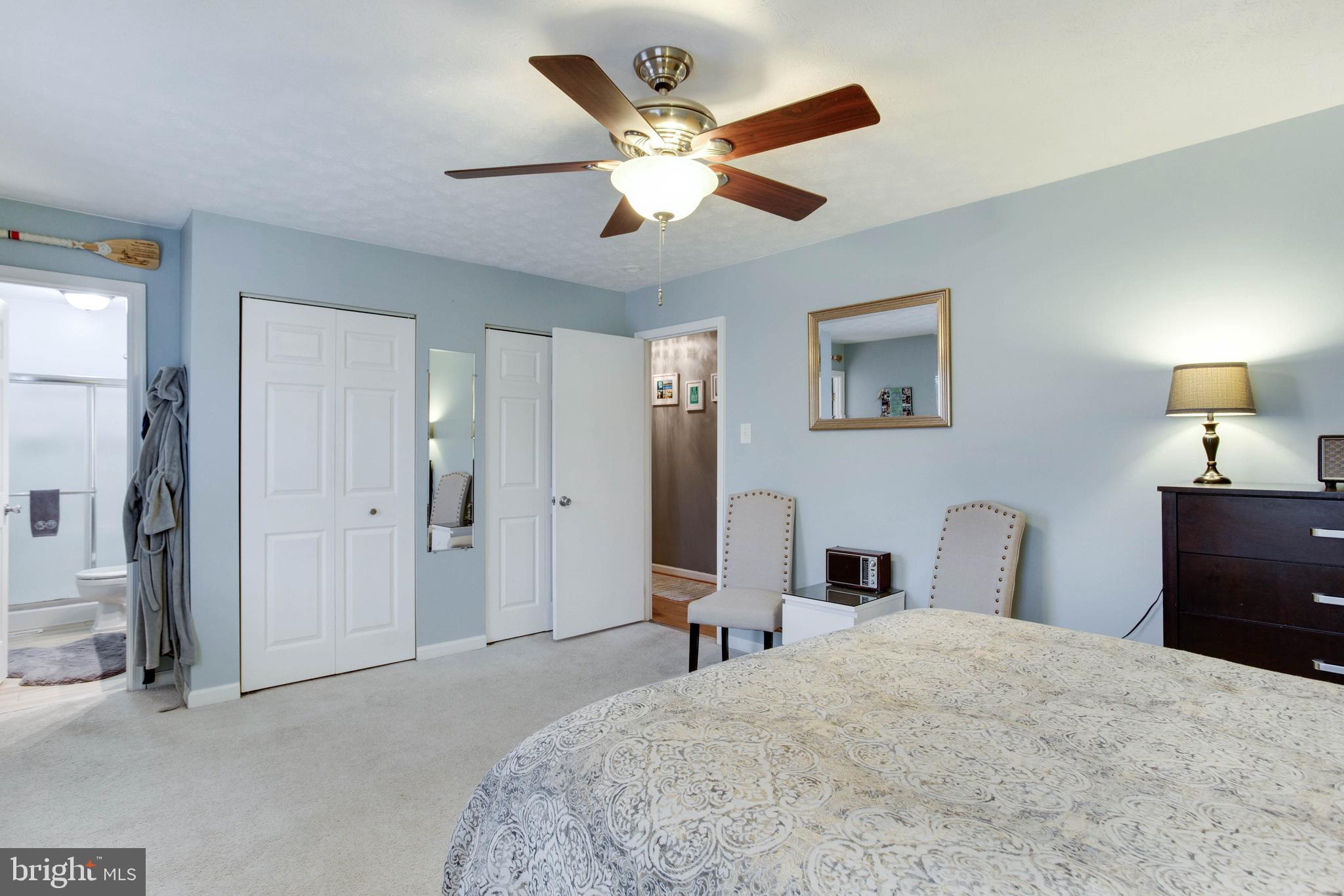 1872 Montreal Road Severn, MD 21144 - Photo 20 of 36 a bedroom with a bed and a large mirror