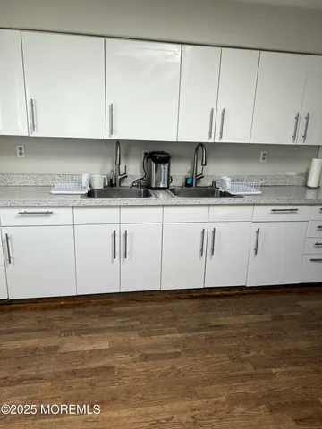 a view of a kitchen with granite countertop cabinets and white appliances