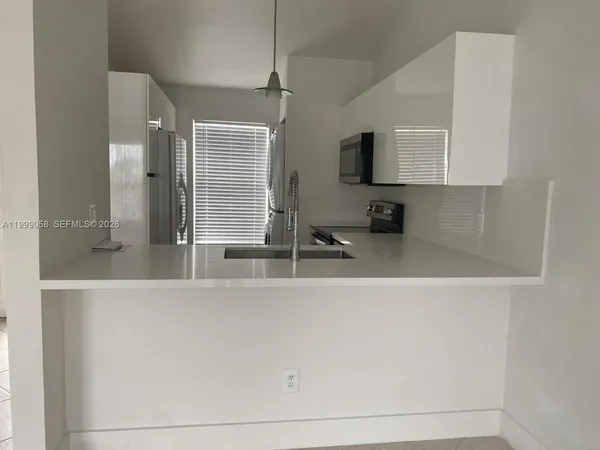 a bathroom with a sink a mirror and a bathtub