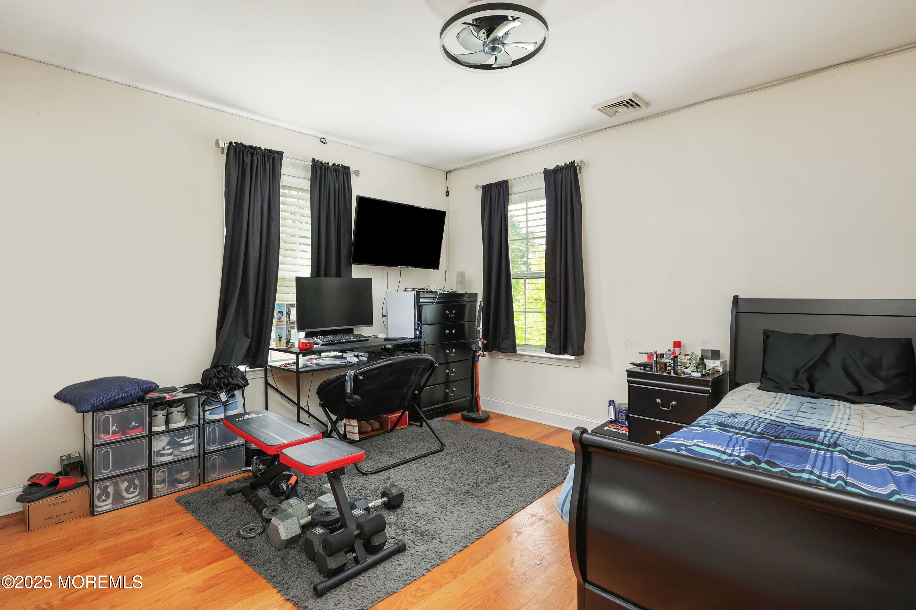 280 Linden Avenue Middletown, NJ 07748 - Photo 16 of 17 a living room with furniture and a flat screen tv