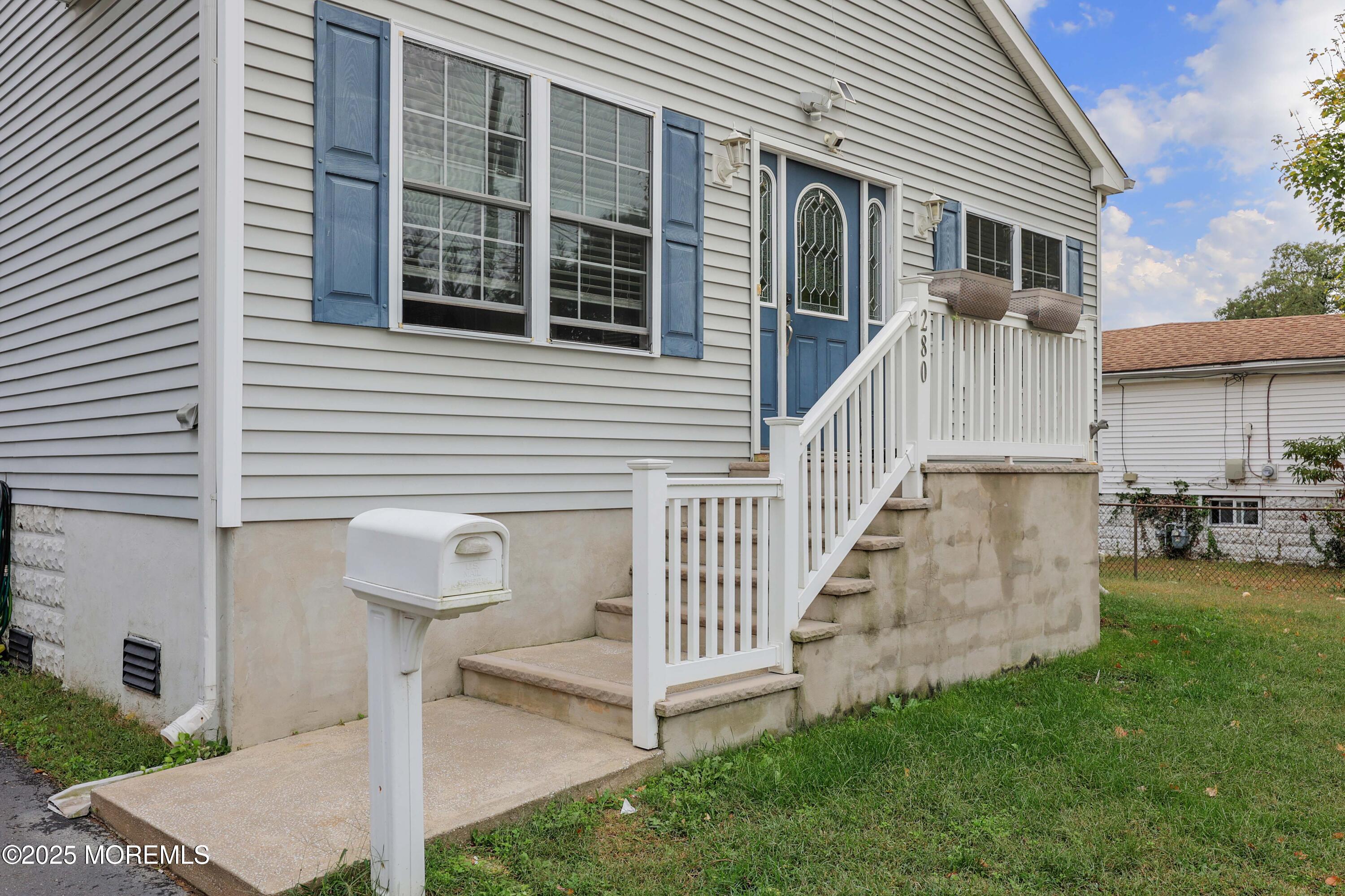 280 Linden Avenue Middletown, NJ 07748 - Photo 2 of 17 a front view of a house with a yard