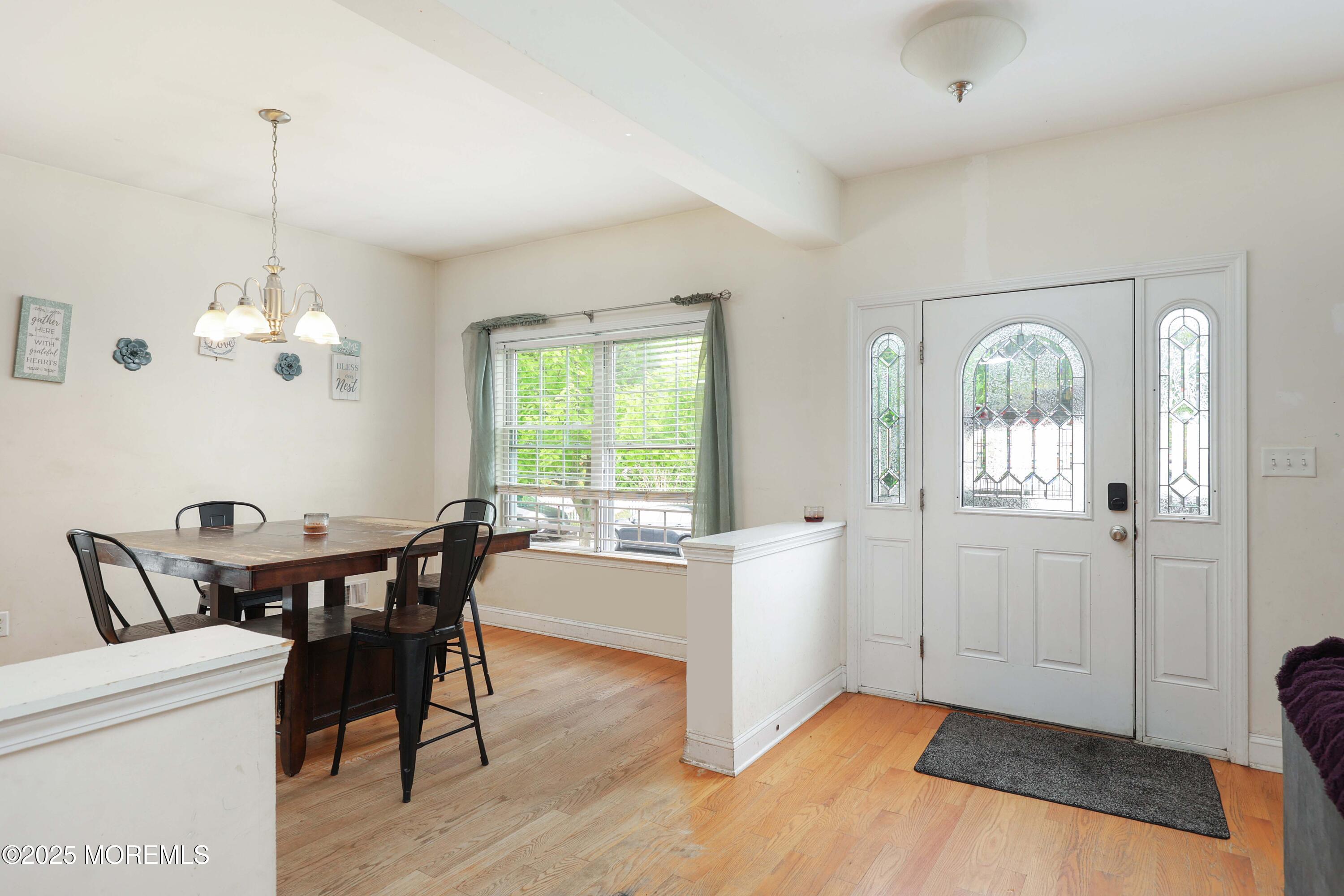 280 Linden Avenue Middletown, NJ 07748 - Photo 3 of 17 a view of a dining room with furniture window and wooden floor