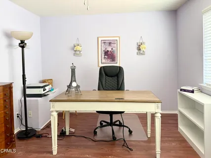 a view of a workspace with furniture