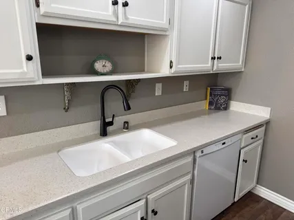 a close view of sink and cabinets