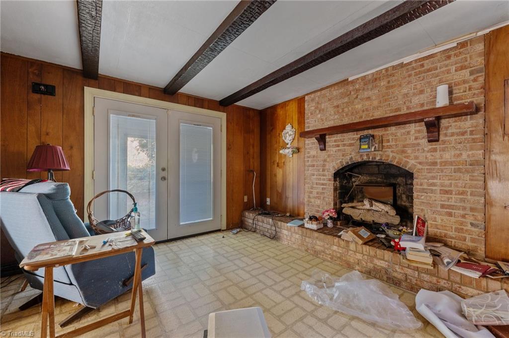 7530 Adler Road Summerfield, NC 27358 - Photo 12 of 31 Den walks out to the sunroom.