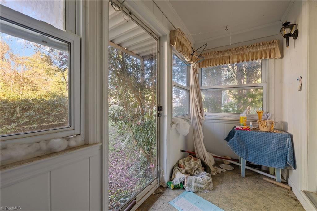 7530 Adler Road Summerfield, NC 27358 - Photo 13 of 31 Sunroom that sits in the front of the home.