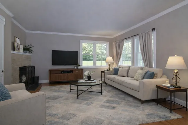 a living room with furniture and a flat screen tv