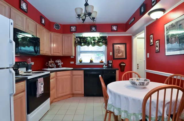 a kitchen with stainless steel appliances granite countertop a stove a sink dishwasher a microwave oven with granite countertops and cabinets