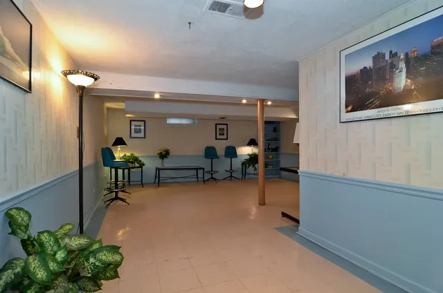 an entryway and livingroom with furniture