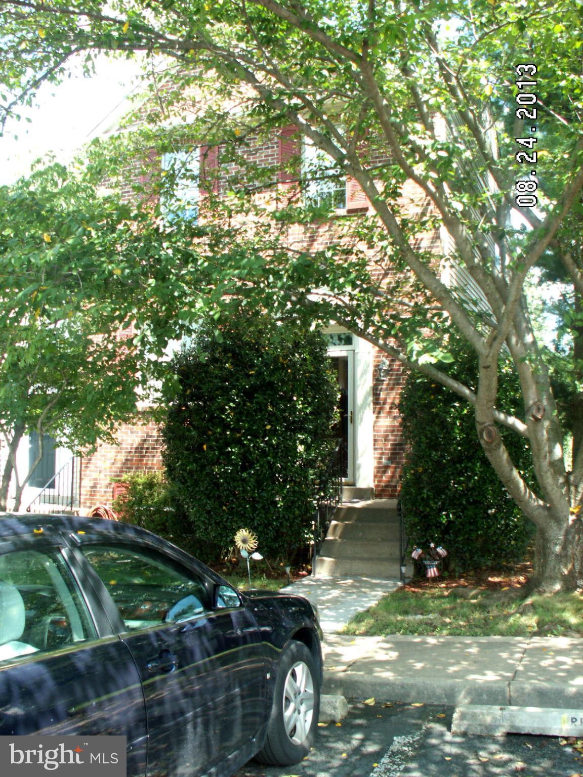 300 Rugby Road Fredericksburg, VA 22406 - Photo 2 of 29 a view of a yard in front of a house with large trees