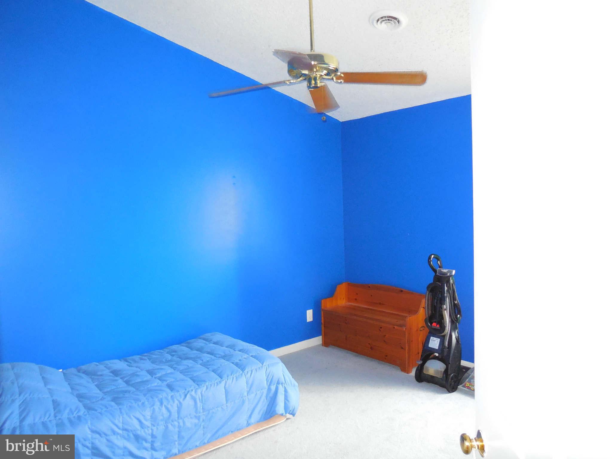 300 Rugby Road Fredericksburg, VA 22406 - Photo 22 of 29 a bedroom with a bed and a ceiling fan