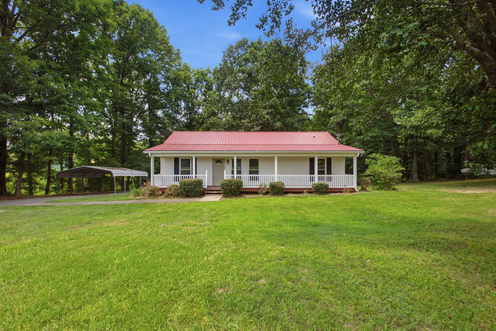 1466 West Grab Creek Road Dickson, TN 37055 - Photo 1 of 30 a front view of a house with a garden