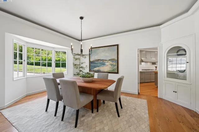 a kitchen with a sink a stove and cabinets