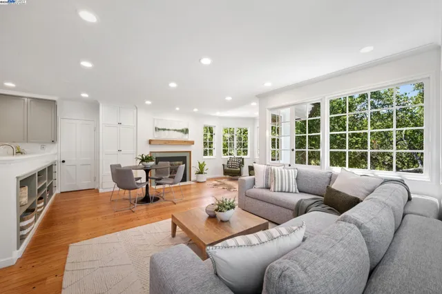 a view of a patio with table and chairs and potted plants