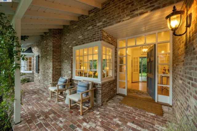 a view of backyard with seating space