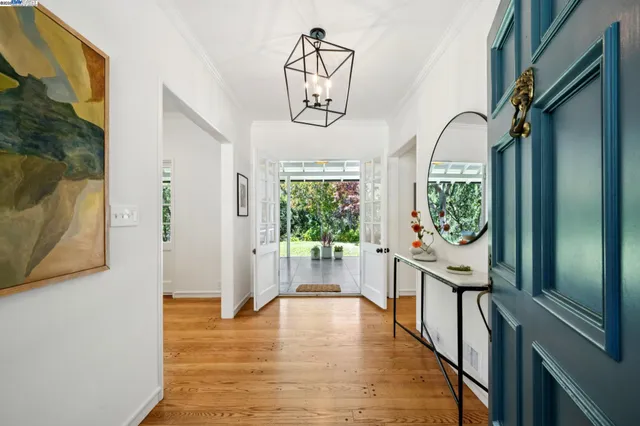 a living room with furniture fireplace and a large window