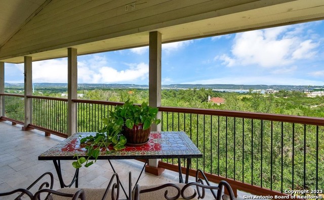 a view of a balcony with furniture