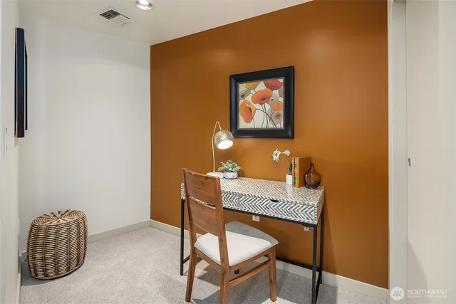 a workspace with furniture and window