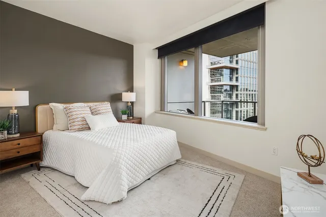 a bedroom with a bed and a window