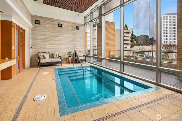 a lobby with furniture and floor to ceiling window