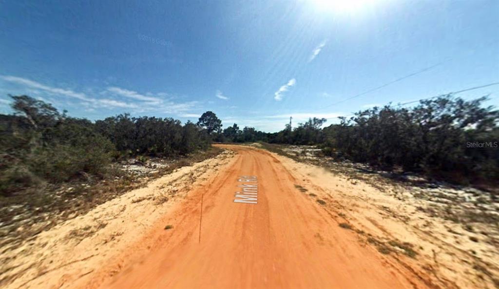 2400 Mink Road Avon Park, FL 33825 - Photo 2 of 9 a view of swimming pool with an outdoor space and seating area
