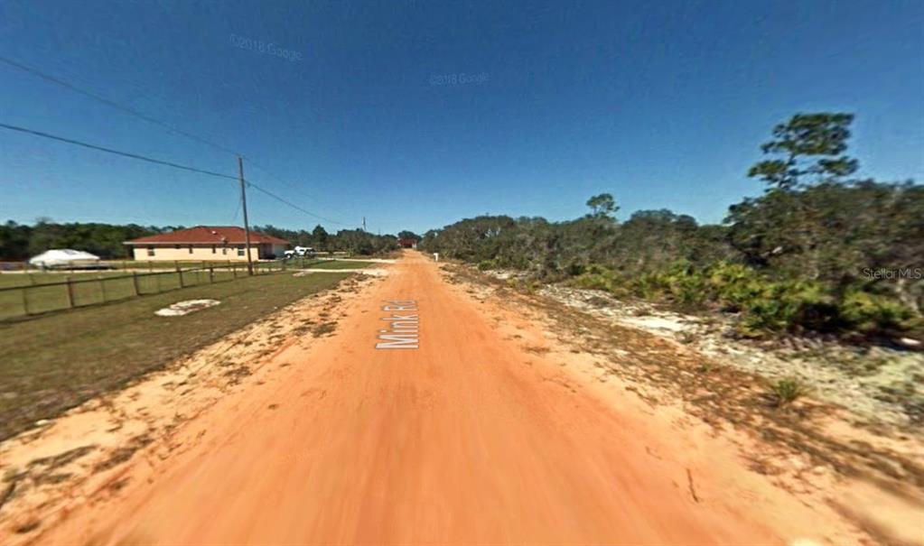 2400 Mink Road Avon Park, FL 33825 - Photo 3 of 9 a view of a lake and mountain