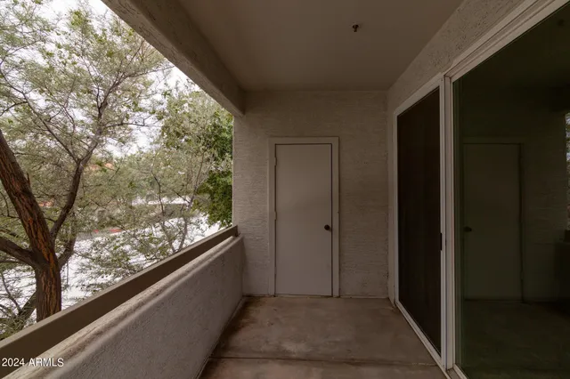 a view of a house with swimming pool and sitting area