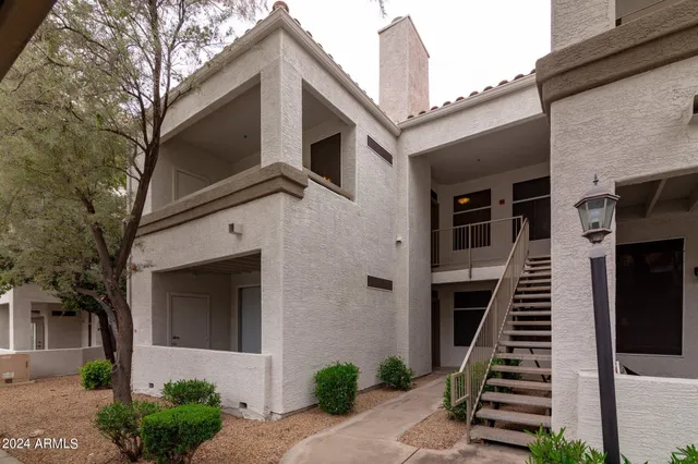 a front view of a house with stairs