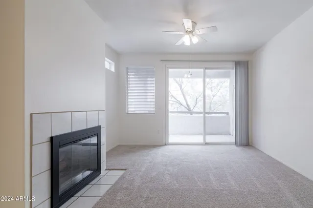 a view of an empty room with a window