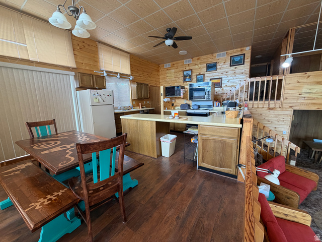 358 South Sky Drive Torrey, UT 84775 - Photo 16 of 82 Open-concept living space featuring wood-finish flooring, plank wood walls, and a wood grid ceiling