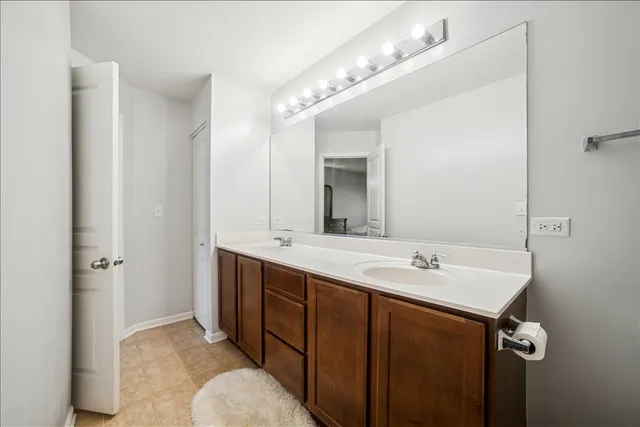 a bathroom with a sink and mirror