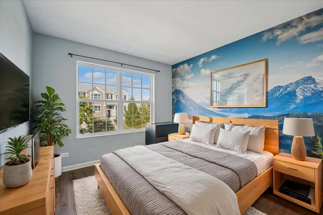 a bedroom with bed and a potted plant