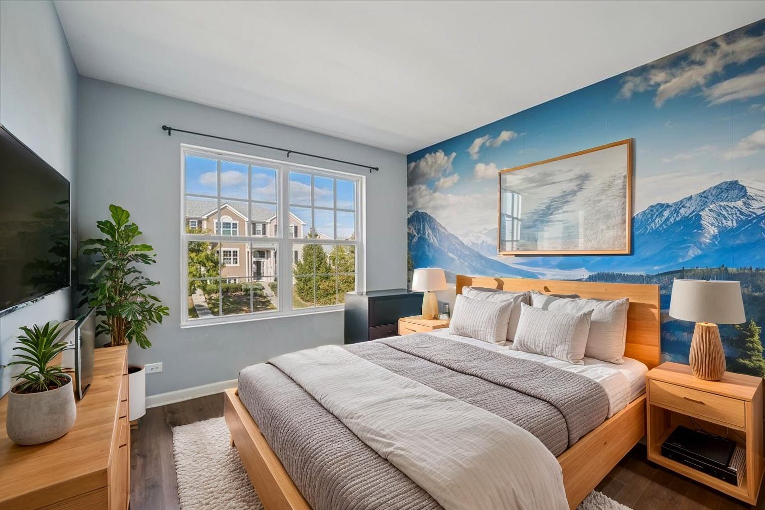 1701 Windward Drive Pingree Grove, IL 60140 - Photo 12 of 19 a bedroom with bed and a potted plant