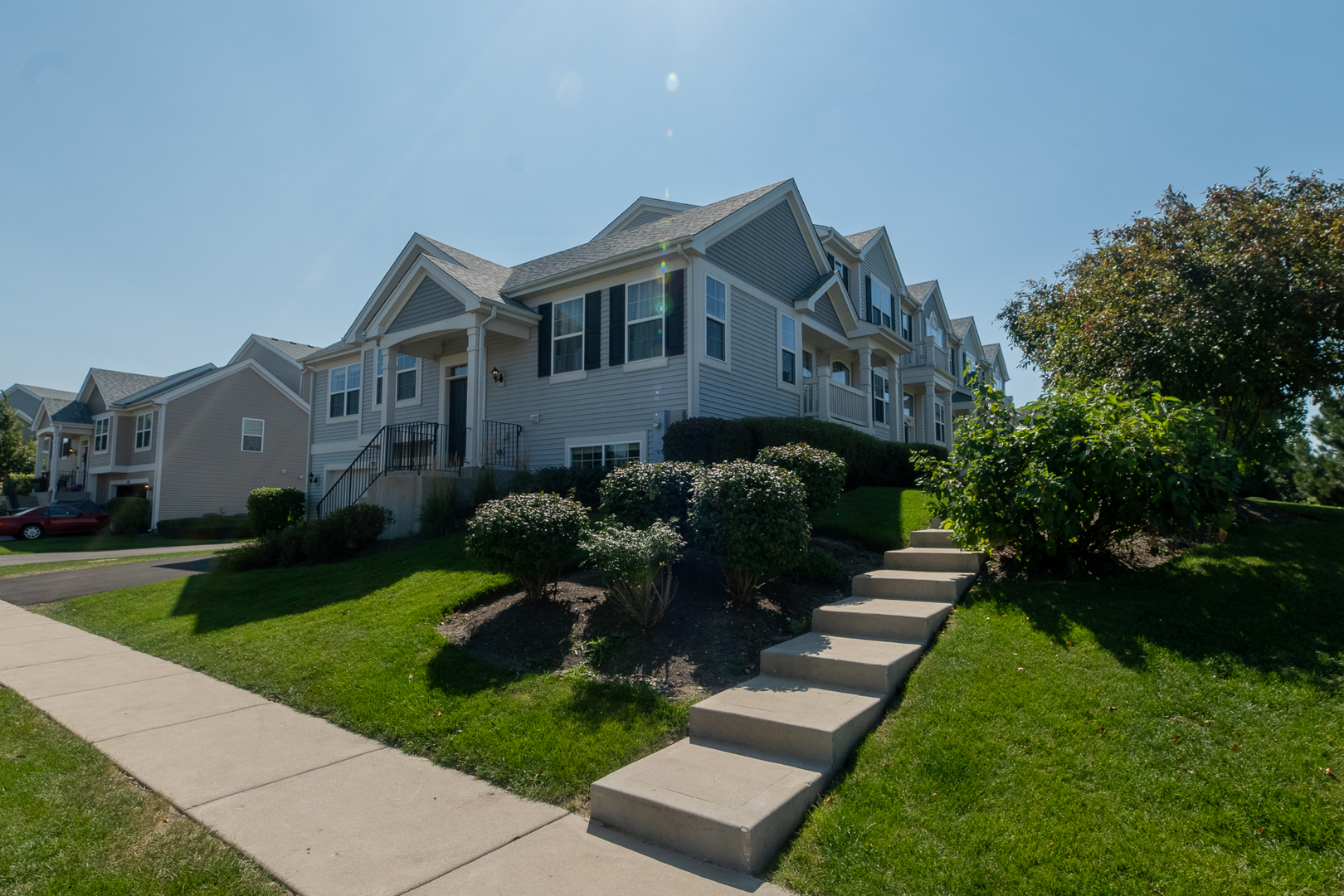 1701 Windward Drive Pingree Grove, IL 60140 - Photo 19 of 19 a front view of a house with a garden