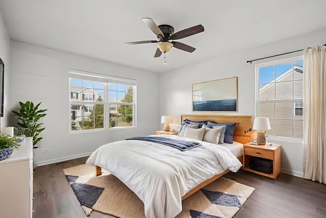 a bed room with a bed and a window