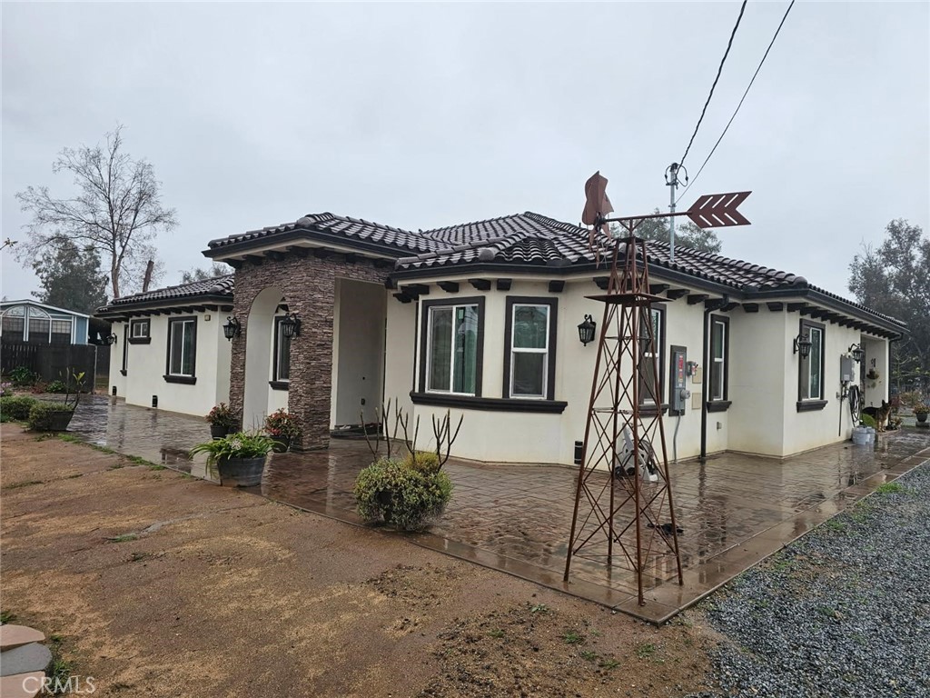 20243 Lee Road Perris, CA 92570 - Photo 18 of 75 a front view of a house with a porch