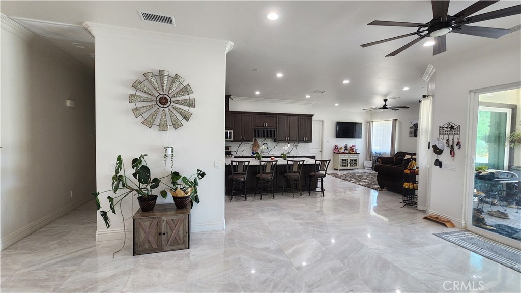 20243 Lee Road Perris, CA 92570 - Photo 19 of 75 a living room with furniture and kitchen view