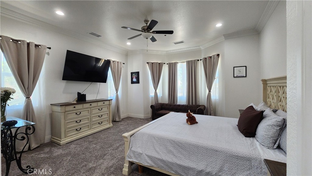 20243 Lee Road Perris, CA 92570 - Photo 30 of 75 a bedroom with a bed and a flat screen tv