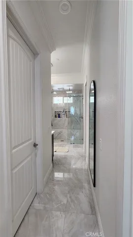 a bathroom with a double vanity sink toilet and shower