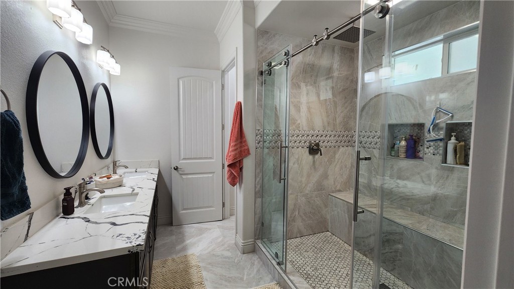 20243 Lee Road Perris, CA 92570 - Photo 34 of 75 a bathroom with a granite countertop sink a toilet and a shower