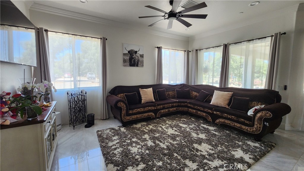 20243 Lee Road Perris, CA 92570 - Photo 42 of 75 a living room with furniture and a large window