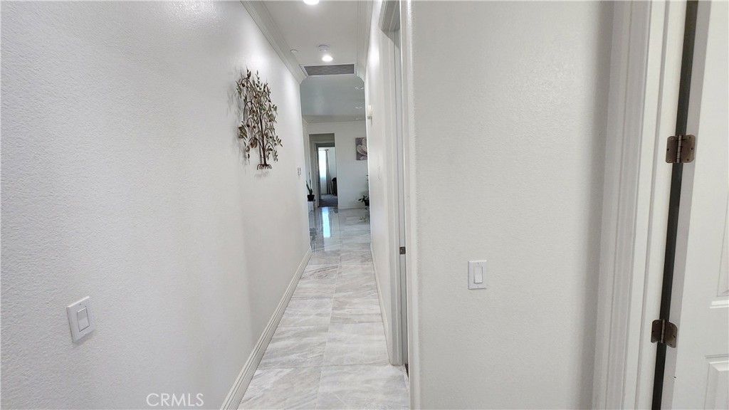 20243 Lee Road Perris, CA 92570 - Photo 49 of 75 a view of a bathroom from a hallway