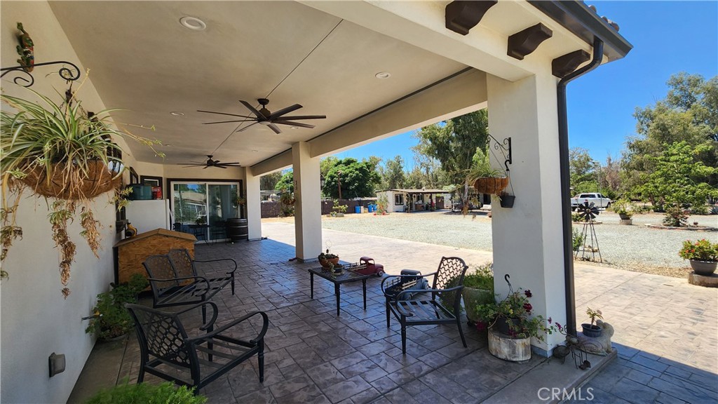 20243 Lee Road Perris, CA 92570 - Photo 7 of 75 a outdoor space with chairs and a potted plant