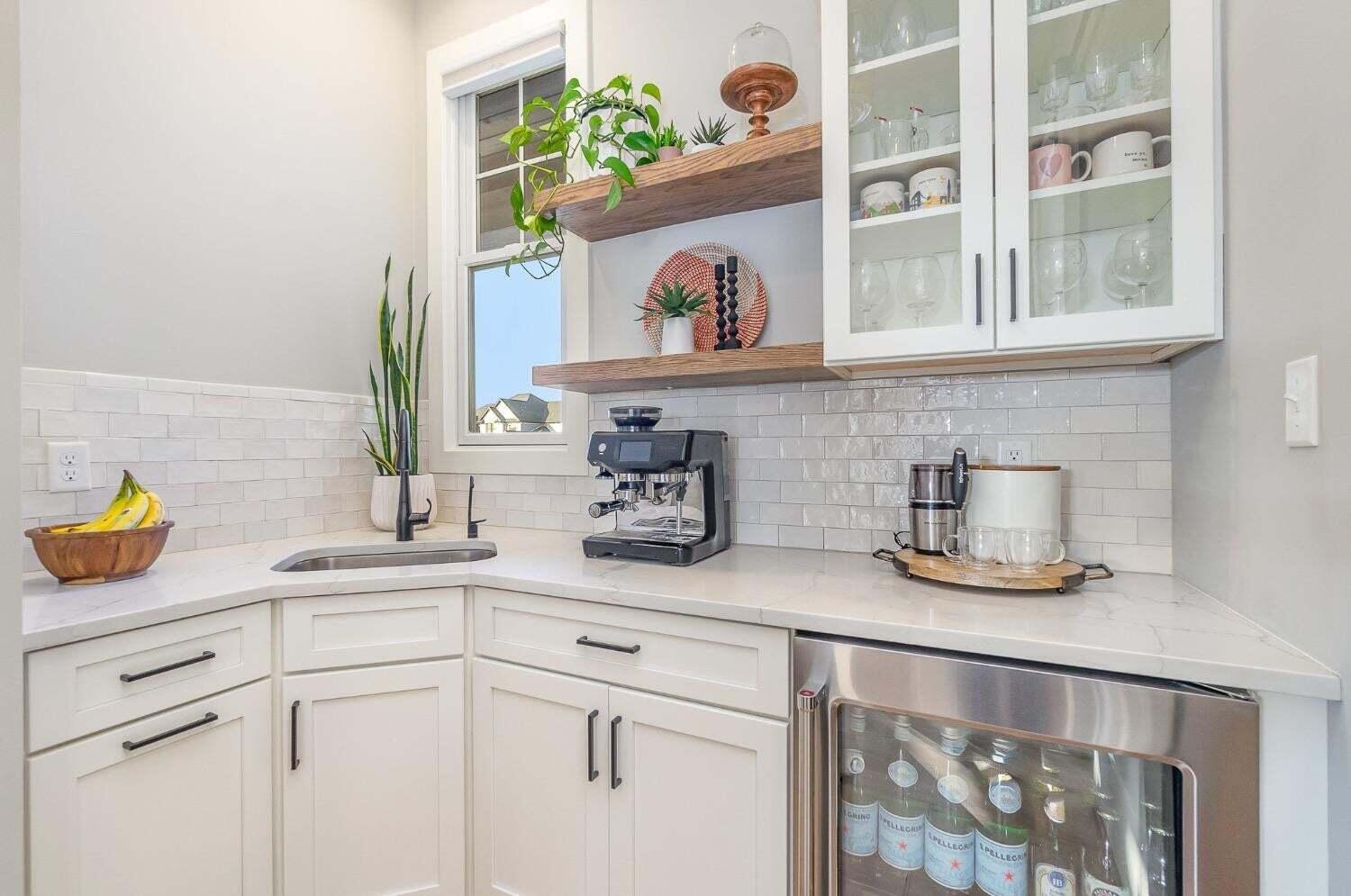 16617 Noble Street Lowell, IN 46356 - Photo 11 of 32 a kitchen with a sink and a white cabinets