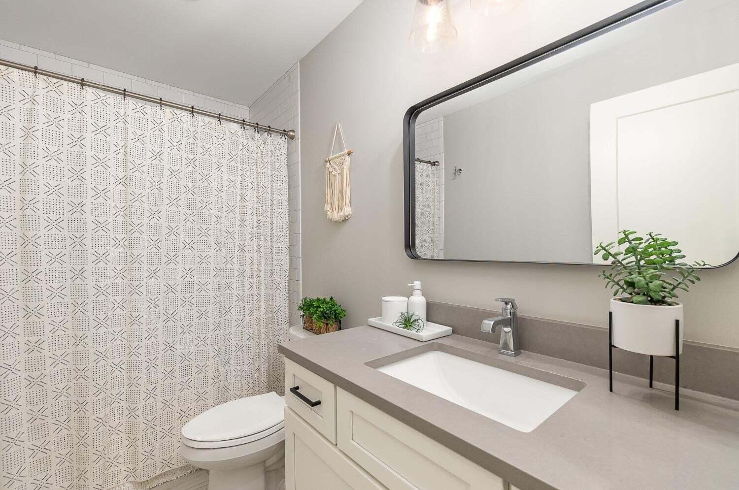 16617 Noble Street Lowell, IN 46356 - Photo 24 of 32 a bathroom with a granite countertop sink mirror and toilet